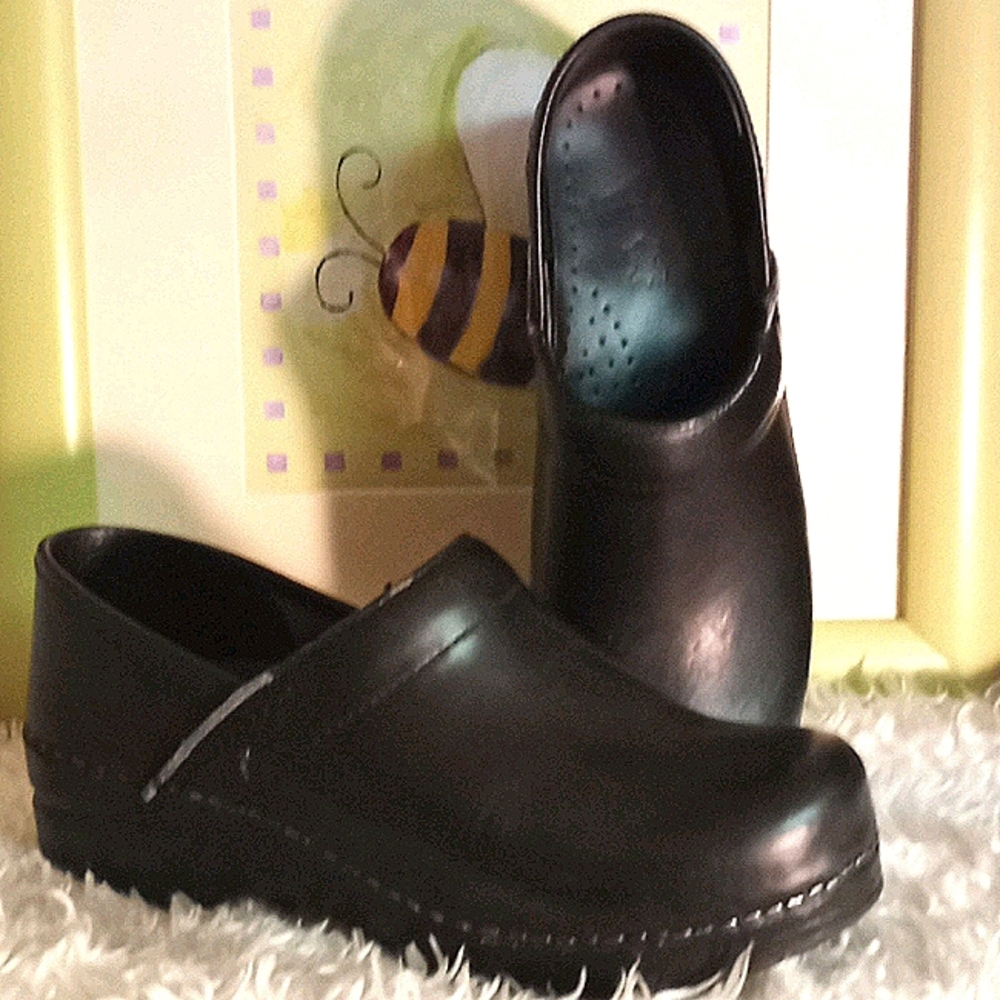 Dansko closed clog with black leather upper.